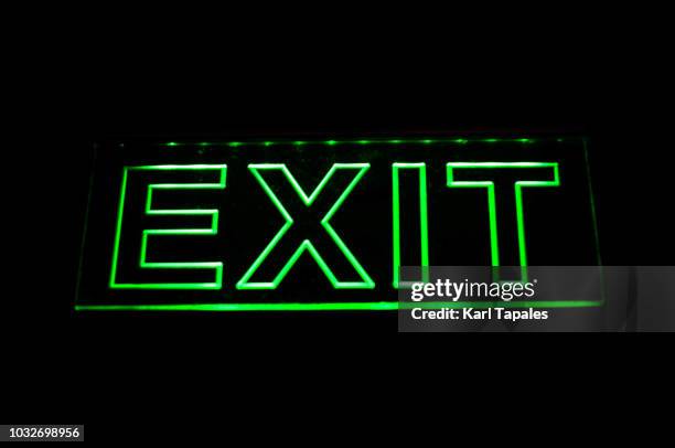 neon green exit sign - fire exit sign stock pictures, royalty-free photos & images