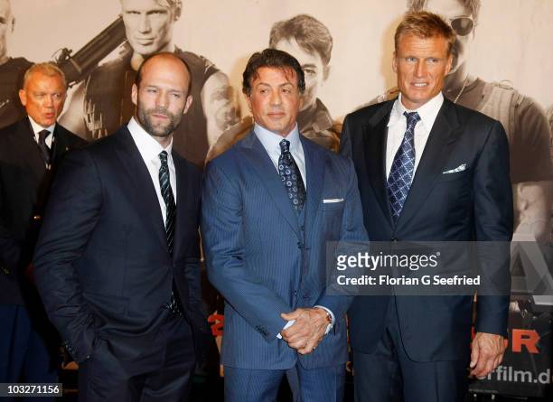 Actor Jason Statham, actor Sylvester Stallone and actor Dolph Lundgren attend the German Premiere of 'The Expendables' at Astor Film Lounge on August...
