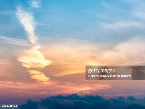 full frame of the surface level view of clouds  and the sun in sky during sunrise. valencian community, spain - sky full frame stock pictures, royalty-free photos & images