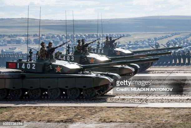 Chinese tanks parade at the end of the day of the Vostok-2018 military drills at Tsugol training ground not far from the borders with China and...