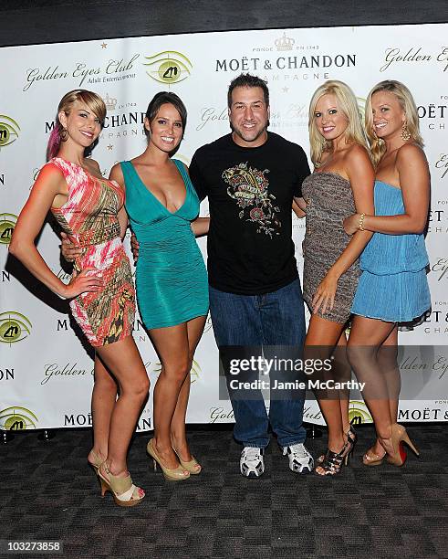 Playboy Playmates Tyren Richard, Lindsey Vuolo, Lauren Anderson and Laurie Fetter with Joey Fatone attend the grand opening of Golden Eyes on August...