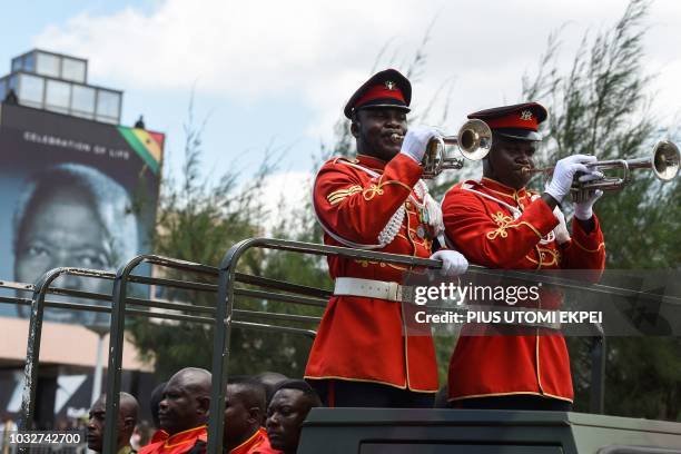 Soldiers blow in trumpets as they lead the procession to the cemetary for the burial of Kofi Annan, a Ghanaian diplomat and former Secretary General...