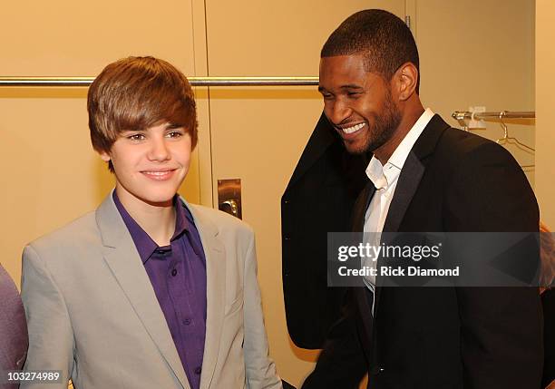 Honoree: Global Youth Leader Award winning recording artist Justin Bieber and Usher, Founder of Usher's New Look backstage at the New Look...