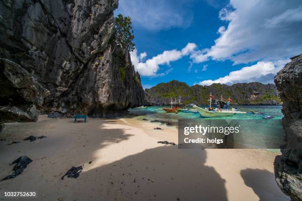 lagoa e uma caverna em el nido, palawan, filipinas - el nido - fotografias e filmes do acervo