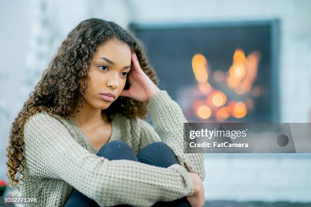 troubled teen stares blankly into the distance - faze rug stock pictures, royalty-free photos & images