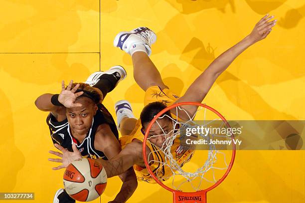 Amber Holt of the Tulsa Shock goes up for a shot against Lindsay Wisdon-Hylton of the Los Angeles Sparks on August 6, 2010 at Staples Center in Los...