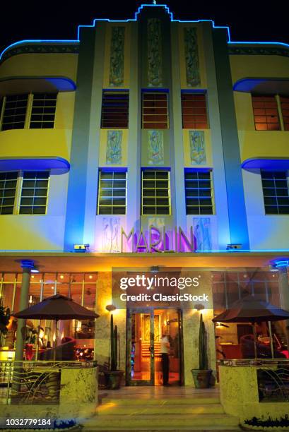 1990s ART DECO BUILDINGS ILLUMINATED AT NIGHT MIAMI BEACH FL USA