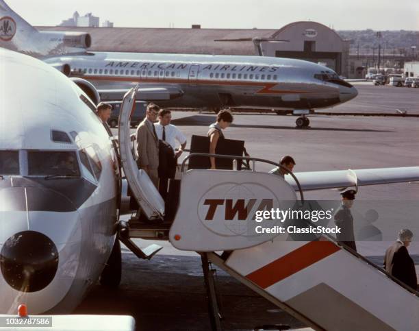 1960s PASSENGERS DEPLANING BOEING 727 TWA JET NEWARK AIRPORT NEW JERSEY USA