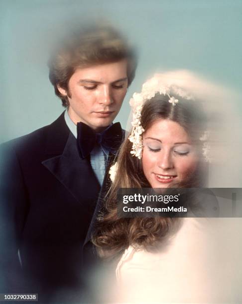 1970s COUPLE BRIDE GROOM PORTRAIT LOOKING DOWN