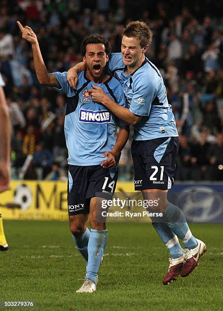 Alex Brosque of Sydney celebrates with Scott Jamieson of Sydney after scoring the opening goal during the round one A-League match between Sydney FC...