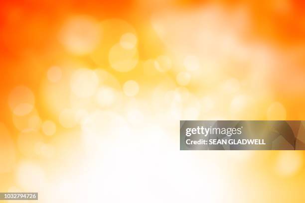 blurred sparkle background - yellow abstract backgrounds stock pictures, royalty-free photos & images