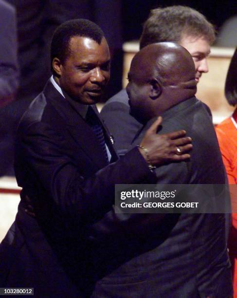 President of the Republic of Congo Denis Sassou-Nguesso greets his Democratic Republic of Congo counterpart Laurent Desire Kabila 03 September 1999...