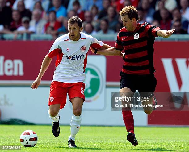 Steffen Bohl of Wehen Wiesbaden battles for the ball with Sead Mehic of Offenbach during the Third League match between SV Wehen Wiesbaden and...