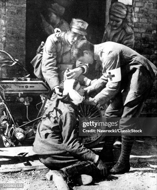 1900s 1910s 1915 WORLD WAR I ITALIAN MOTORCYCLE DISPATCH RIDER BEING GIVEN FIRST AID