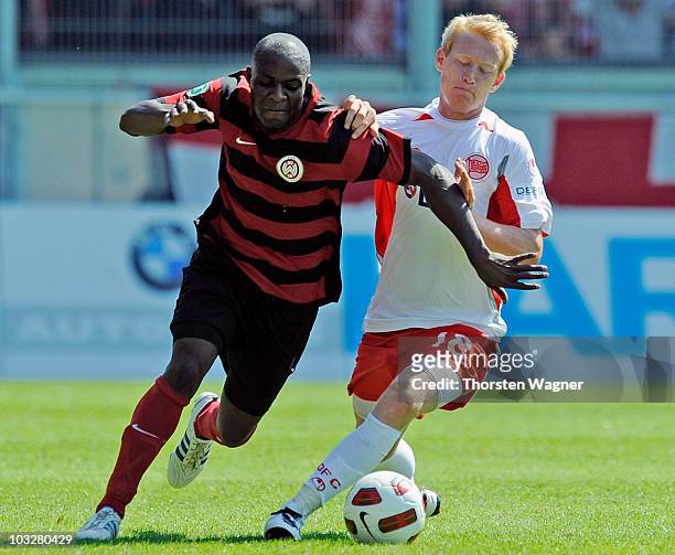 Addy-Waku Menga of Wehen Wiesbaden battles for the ball with Steffen Haas of Offenbach during the Third League match between SV Wehen Wiesbaden and...