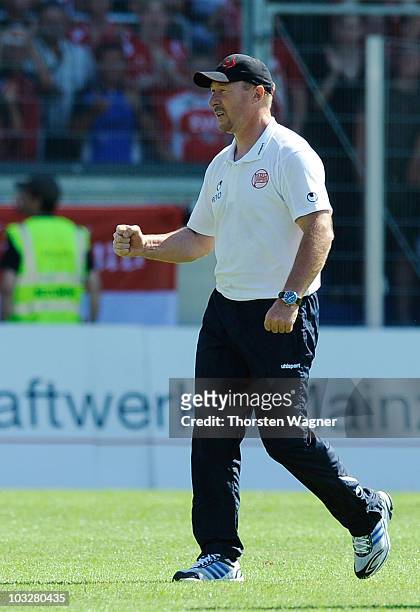 Head coach Wolfgang Wolf of Offenbach celebrates after winning the Third League match between SV Wehen Wiesbaden and Kickers Offenbach at the Brita...