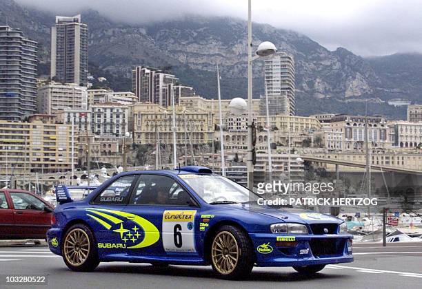British Richard Burns and co-pilot Robert Reid power their Subaru Impreza WRC at the start of the 67th edition of the Monaco Rally 17 January.