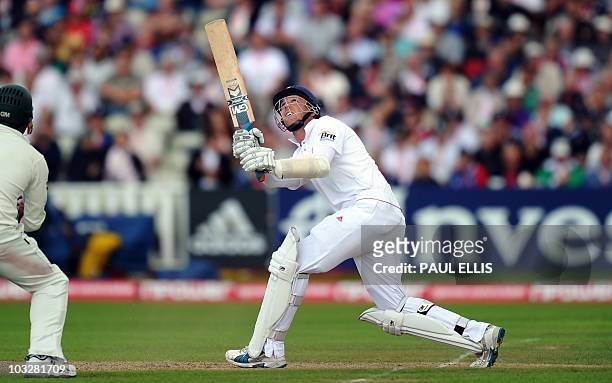 England batsman Graemme Swann watches his shot as he is caight and bowled by Pakistan bowler Saeed Ajmal on the second day of the second NPower Test...