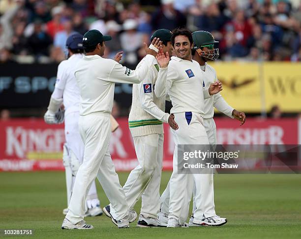 Saeed Ajmal of Pakistan celebrates after taking the wicket of Graeme Swann of England during day two of the 2nd npower Test Match between England and...