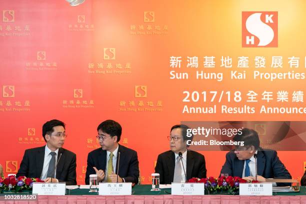 From left to right, Christopher Kwok, executive director of Sun Hung Kai Ltd., Allen Fung, executive director of Sun Hung Kai Ltd., Victor Lui deputy...