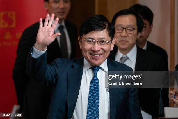 Raymond Kwok, chairman of Sun Hung Kai Properties Ltd., waves as he departs a news conference in Hong Kong, China, on Thursday, Sept. 13, 2018. Sun...