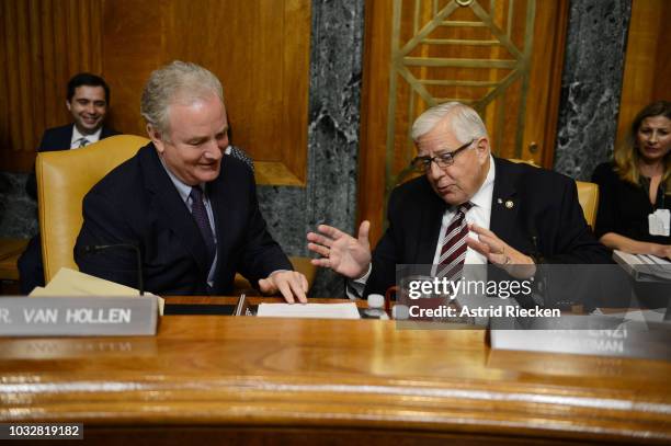 Chairman of the US Senate Committee on the Budget, Mike Enzi , right, and Senator Chris Van Hollen, a Democrat from Maryland, speak to each other...