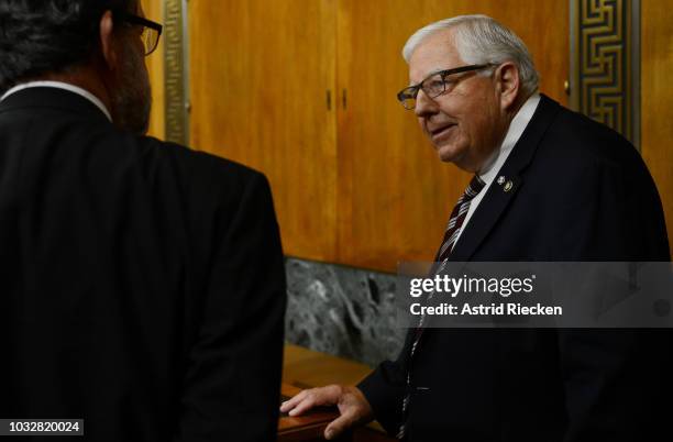 Chairman of the US Senate Committee on the Budget, Mike Enzi , right, speaks to Congressional Budget Office Director Keith Hall after Hall testified...