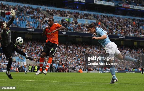 Gareth Barry of Manchester City scores the opening goal during the pre-season friendly match between Manchester City and Valencia at the City of...