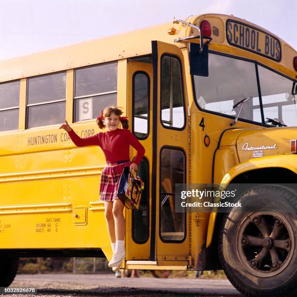 1970s LITTLE GIRL PIGTAILS RED TOP PLAID SKIRT WHITE SNEAKERS BOOK BAG JUMPING OFF YELLOW SCHOOL BUS
