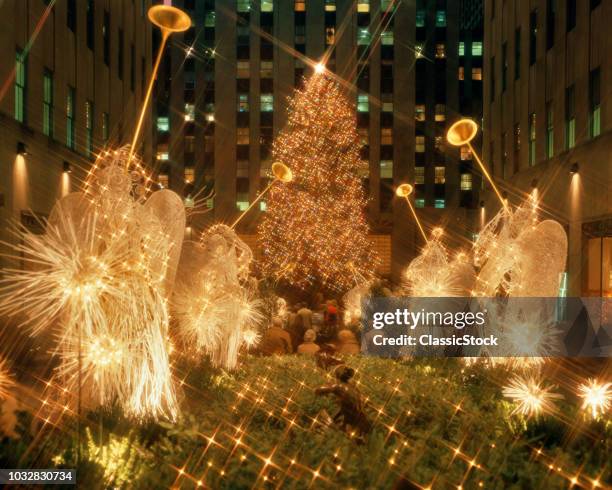 1980s ROCKEFELLER CENTER LIGHTED ANGELS AND CHRISTMAS TREE NEW YORK CITY NEW YORK USA