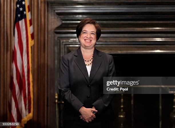 Elena Kagan smiles after being sworn in as the Supreme Court's newest member by Chief Justice John Roberts at the Supreme Court Building August 7,...
