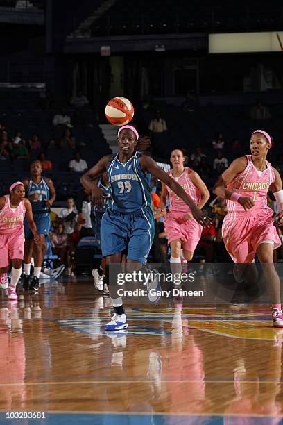 Hamchetou Maiga-Ba of the Minnesota Lynx battles Tamera Young of the Chicago Sky for possession of a loose ball during the WNBA game on August 7,...