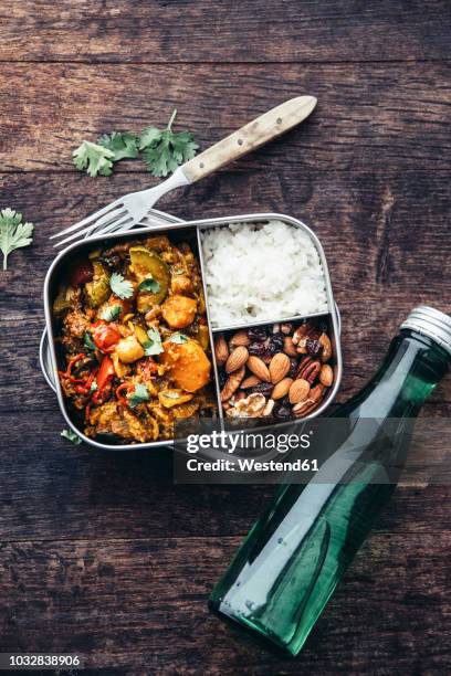 take away food, tamarind vegetable stew, carrot, zucchini, bell pepper, eggplant, onion, tomato and falafel balls, rice and nuts with raisins - falafel stock-fotos und bilder