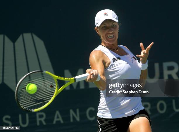 Svetlana Kuznetsova of Russia hits a forehand to Flavia Pennetta of Italy during their semifinal match in the Mercury Insurance Open at La Costa...