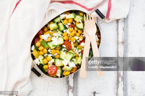 lunch box of salad with chick peas roasted with curcuma, feta, cucumber, tomatoes and parsley - chick pea salad stock pictures, royalty-free photos & images