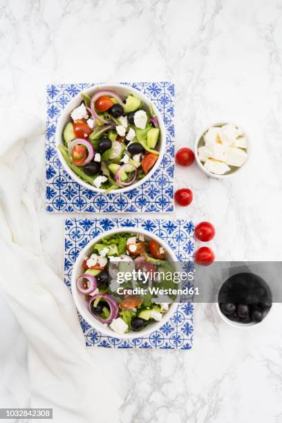 two bowls of greek salad - greek salad stock pictures, royalty-free photos & images