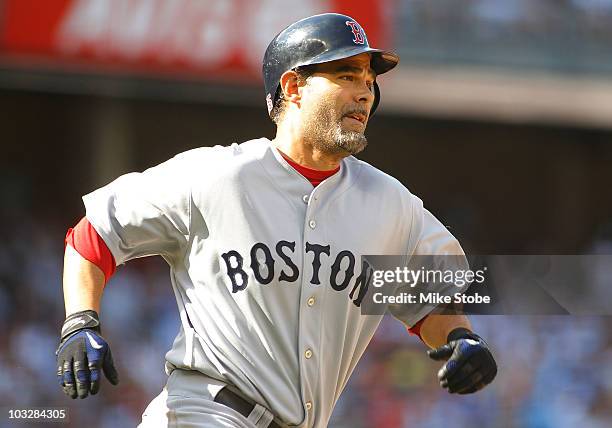 Mike Lowell of the Boston Red Sox hits an RBI double in the second-inning against the New York Yankees on August 7, 2010 at Yankee Stadium in the...