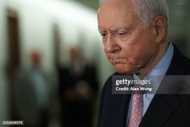 Sen. Orrin Hatch speaks to members of the media as he arrives at a markup hearing before the Senate Judiciary Committee September 13, 2018 on Capitol...