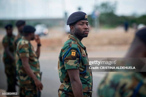 Soldiers stand guard near the Burma Camp military cemetery in Accra on September 13 during the funeral ceremony of Kofi Annan, a Ghanaian diplomat...