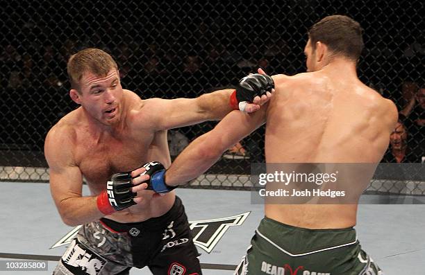 Matt Hughes punches Ricardo Almeida during the UFC Welterweight bout at Oracle Arena on August 7, 2010 in Oakland, California.