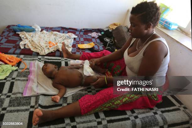 African Babies Wearing Diapers Photos And Premium High Res Pictures african-babies-wearing-diapers-photos-and-premium-high-res-pictures