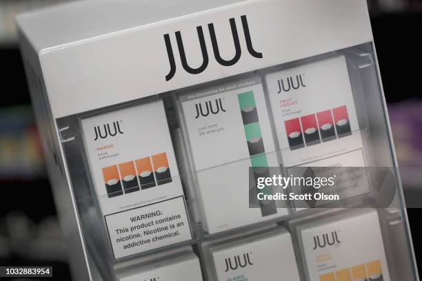 Electronic cigarettes and pods by Juul, the nation's largest maker of vaping products, are offered for sale at the Smoke Depot on September 13, 2018...