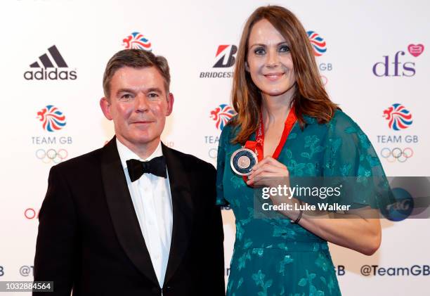 Team GB heptathlete Kelly Sotherton receives her bronze medal from the 2008 Olympics and Sir Hugh Robertson attends The Team GB Ball 2018 held at The...