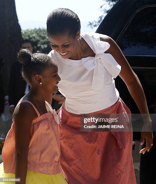 First Lady Michelle Obama and her daughter Sasha arrive at the Marivent Palace in Palma de Mallorca, on August 8, 2010. US First Lady Michelle Obama...