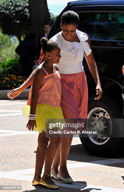 First lady Michelle Obama and her daughter Sasha Obama arrive at the Marivent Palace on August 8, 2010 in Palma de Mallorca, Spain.