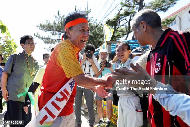 Opposition 'All Okinawa' movement backed candidate Denny Tamaki visits a hut set up by anti-U.S. Airbase relocation protesters as the Okinawa...