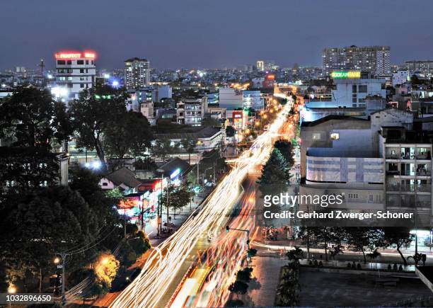 busy road, arterial road at night, ho chi minh city, saigon, vietnam - vietnam war photos stock-fotos und bilder