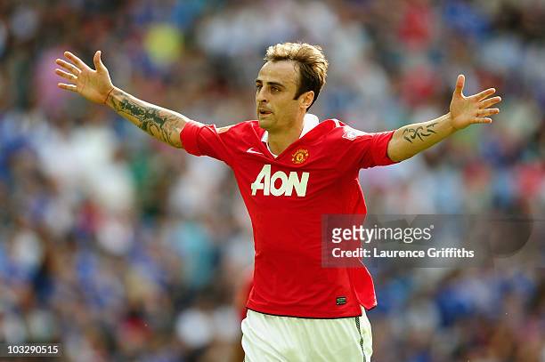 Dimitar Berbatov of Manchester United celebrates as he scores their third goal during the FA Community Shield match between Chelsea and Manchester...