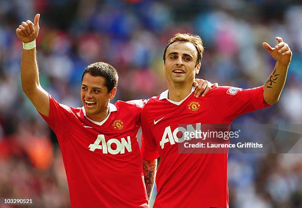Dimitar Berbatov of Manchester United celebrates with Javier Hernandez as he scores their third goal during the FA Community Shield match between...