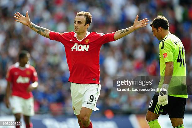 Henrique Hilario of Chelsea looks dejected as Dimitar Berbatov of Manchester United celebrates as he scores their third goal during the FA Community...